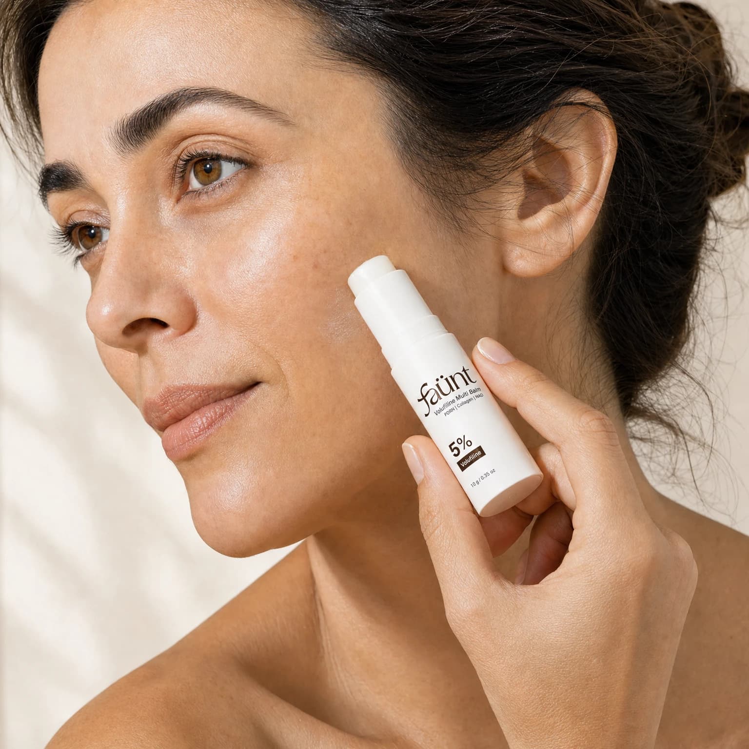 The balm touching the cheek during application